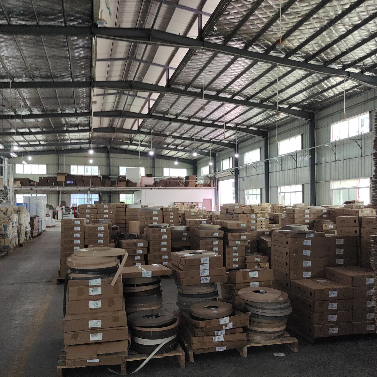 Palletised finished PVC edge banding stock in the export warehouse
