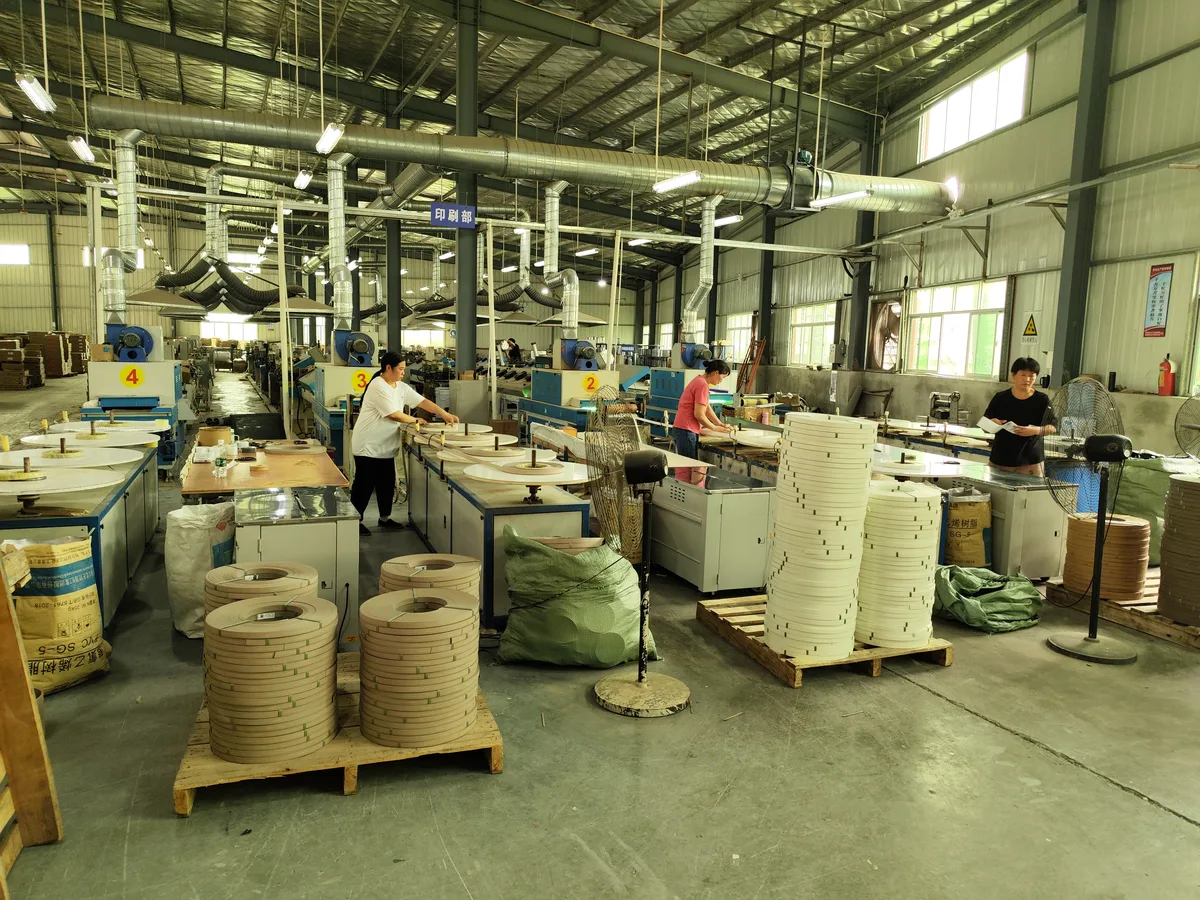 GONGDA edge banding workshop with workbenches and material rolls